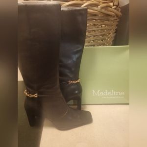 Madeline Shoes black boots with gold link chain at ankle